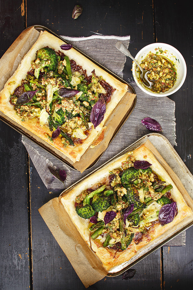 A birds eye view of two homemade broccoli and onion jam tarts. 